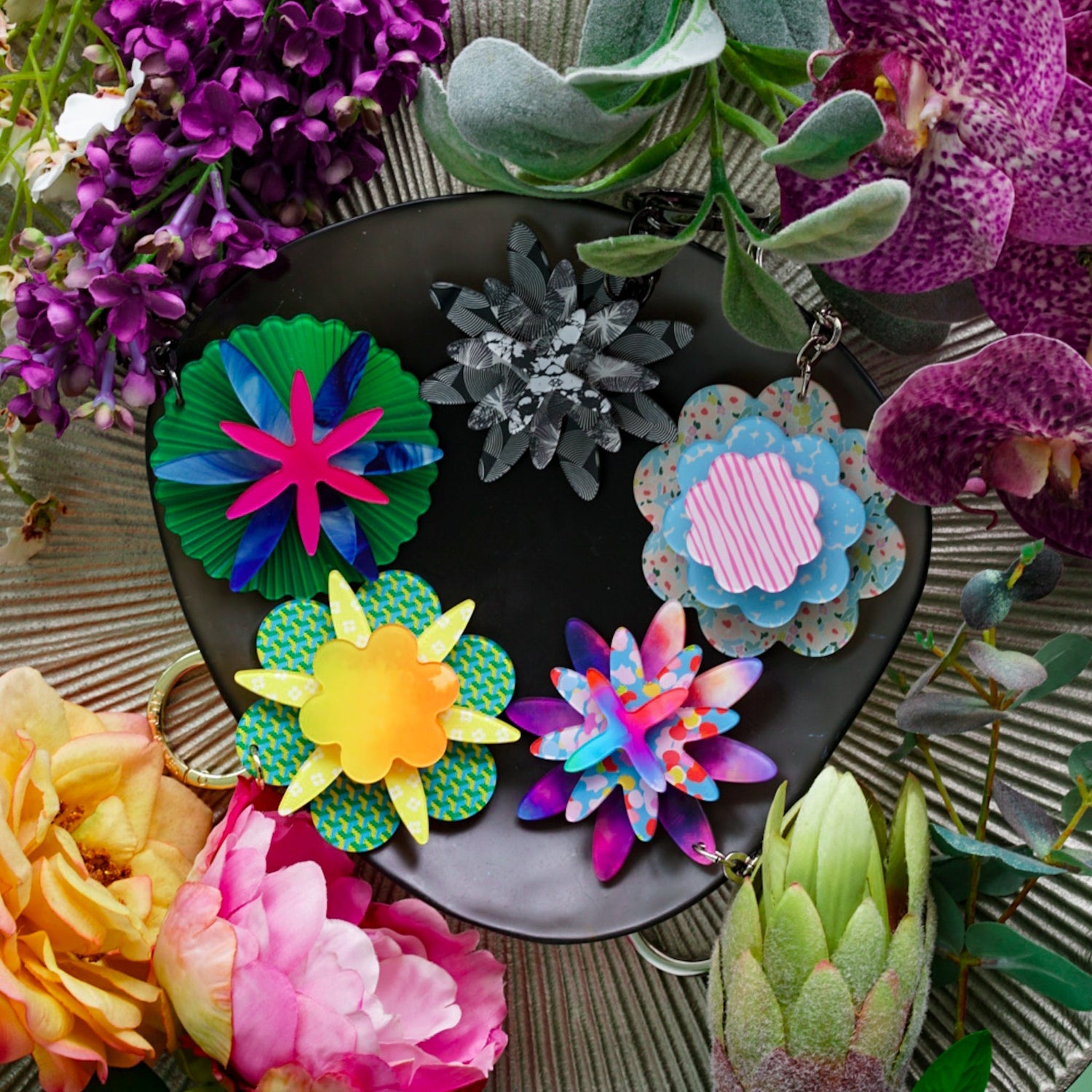 A colourful array of Lilt Tote Floral Bag Charms 